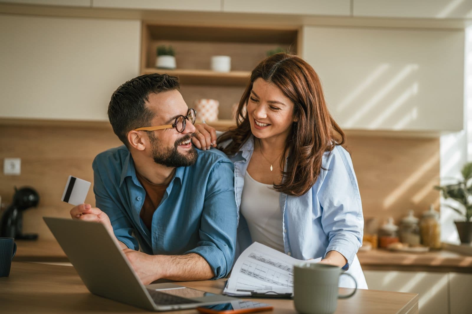 Couple reviewing insurance options on a laptop at home